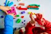 gender-neutral play two toddlers hands wiith play-doh