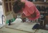 woman making a busy board woodworking project